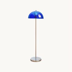 a floor lamp with a blue shade on it