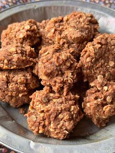 a metal plate filled with cookies on top of a table