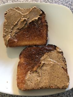 two pieces of bread with peanut butter on them