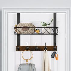 a white door with some purses hanging on it