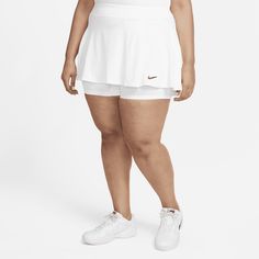 Own the court in this skirt. The flouncy, stretchy design is made from lightweight fabric that's made with at least 75% recycled polyester fibers. A single pleat in the front gives you room to move while you run and slide. White Elastane Mini Skirt, White Stretch Ruffled Skort, White Stretch Skort With Ruffled Detail, White Flowy Skort Short Length, White Flowy Tiered Tennis Skirt, White Ruffled Skort With Relaxed Fit, Nike Fitted Pleated Skirt, Fitted Nike Pleated Skirt, Nike Stretch Lined Skirt Bottoms