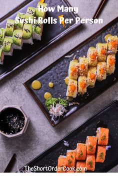 sushi rolls are served on black plates with chopsticks