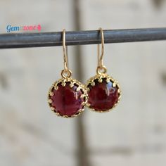 A romantic style for this pair of earrings with a setting of natural Garnet stones. The natural Garnet is known for thousands of years and in its early references, it is mentioned as a healing gemstone. It has a reddish color, deep as wine. Garnet is considered to be the birthstone of January. The part of the earrings which goes in the ear is made of Gold-filled. The setting around the stones is 2-micron gold deep (very thick coating). Gemstone: natural Garnet * Also available in natural Blue Ag Garnet Drop Earrings, Red Garnet Earrings, Opal Drop Earrings, Gemstone Earrings Gold, Long Gold Earrings, Gold Bridal Earrings, Earrings Gemstone, Gold Bead Necklace, Agate Earrings