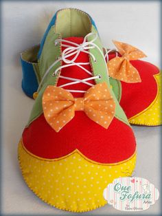 a pair of colorful shoes with bows on them