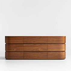 a large wooden dresser sitting on top of a white floor