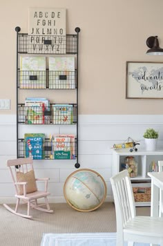 a child's room with bookshelves, toys and other items on the wall