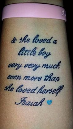 a woman's arm with a tattoo saying, and she loved a birth boy