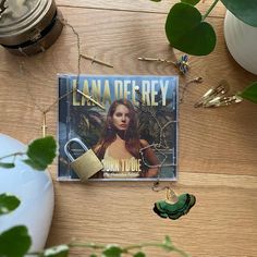 there is a magazine on the table next to some plants and other things in front of it