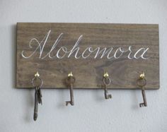 a wooden sign with keys hanging from it