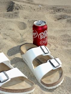 White Birkenstocks next to a cold can of dr.pepper in the sand on a beach Dr Pepper Aesthetic, Pepper Aesthetic, Floral Mini Dress Summer, Aesthetic Beach Photo, White Birkenstock, White Birkenstocks, Puka Shell Necklace, Camera Digital