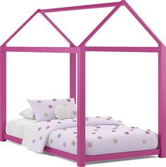 a child's bed with pink frame and polka dot bedspread on it