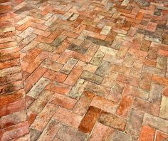 an image of a brick floor that looks like it is made out of stone or bricks