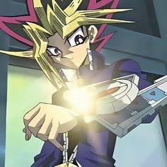 an anime character holding a nintendo wii game controller in his hand and looking at the camera