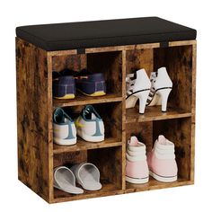 a wooden shoe rack filled with pairs of shoes