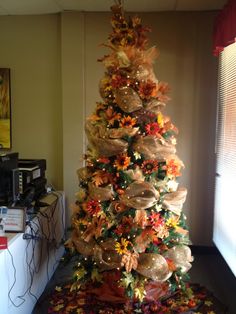 a decorated christmas tree in the corner of a room