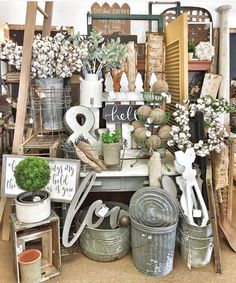 a room filled with lots of different types of plants and decorations on top of each other