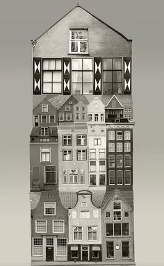 a tall building with lots of windows on it's side in black and white