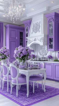 a dining room with purple furniture and flowers in vases on top of the table