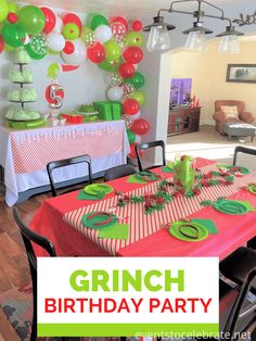 an image of a birthday party with green and red balloons on the wall above the table