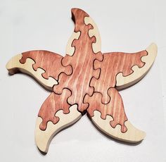 a wooden puzzle piece shaped like a starfish