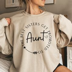 Introducing our "The Best Sisters Get Promoted To Aunt" sweatshirt, the perfect holiday gift for that special aunt in your life! This cozy and stylish Aunt sweatshirt is not only a fashionable statement piece but also a heartwarming pregnancy reveal to your beloved sister. Crafted with premium quality material, this Aunt shirt offers utmost comfort and durability. It will surely become her go-to piece for every occasion. Show your appreciation and love with this charming Aunt sweat shirt, a thou Promoted To Aunt, Aunt Sweatshirt, Gift For Aunt, Great Aunt, Aunt Shirts, Best Sister