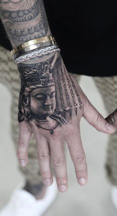 a person with a tattoo on their hand