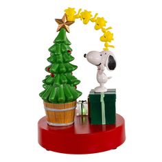 a charlie brown christmas tree with snoopy on top