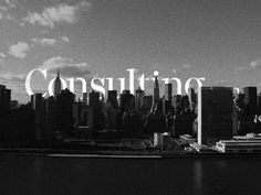 black and white photograph of city skyline with the word consulting spelled out in large letters