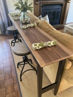 a living room with a couch, table and chairs