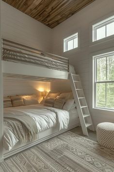 there is a bunk bed in the room with two windows and a ladder on the wall