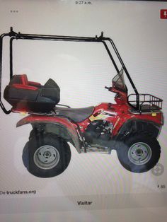 a red four - wheeler is shown on the screen