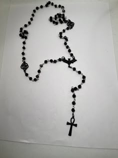 Gorgeous black beaded rosary inspired by vampires.  Black enamel alloy bat, black alloy roses and a stainless steel gunmetal colour anhk completes this look.  Please note all my rosaries are extra long to suit different body types and shapes and gives you the option to do a revolution around your neck for a layered look.  This rosary is on the smaller end compared to the other rosaries i have on site.  It will be great on its own or layered with a long rosary like Nancy Downs.  Please ask any qu Black Vampire Jewelry For Festival, Vampire Style Black Jewelry For Festivals, Black Beaded Cross-shaped Rosary, Black Beaded Cross Rosary, Black Gothic Jewelry With 8mm Beads, Nancy Downs, Belly Conklin, Rosary Style Necklace, Black Vampire