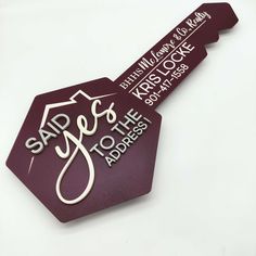 a close up of a tag on a white surface with the words said yes to the address