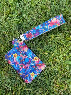 a tie laying on the ground in the grass