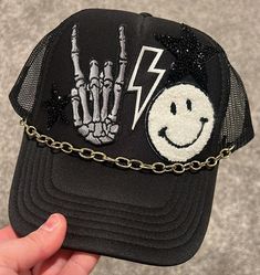 Rocker themed trucker hat Punk Style Cap Hat, Punk Style Cap One Size Fits Most, Punk Cap Hat One Size Fits Most, Casual Black Hat For Music Festival, Punk Halloween Streetwear Hat, Punk Style Hat For Streetwear, Punk Style Hat For Streetwear, One Size Fits Most, Festival Trucker Snapback Hat With Flat Brim, Festival Trucker Hat With Flat Brim