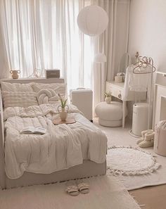 a bed room with a neatly made bed next to a window and a rug on the floor