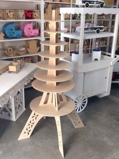 the shelves are made out of plywood and have different designs on them, including an eiffel tower