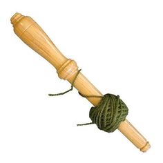 a ball of yarn wrapped around a wooden stick