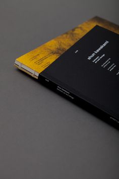 a yellow and black book sitting on top of a table