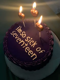 a birthday cake with three candles on it