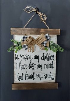 a sign hanging on the side of a wall that says i'm passing my children i have lost my mind but found my soul