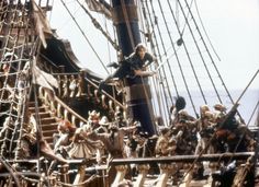 a group of figurines on the deck of a pirate ship