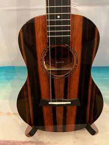 an acoustic guitar is on display in a case