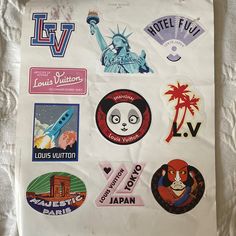 a bunch of stickers on a white sheet