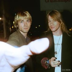 two young men standing next to each other