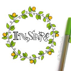 a pen and marker sitting on top of a paper with the word inspire written in it