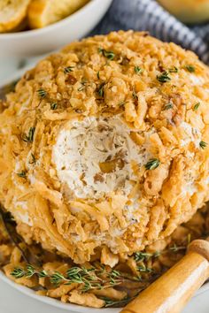 french onion cheese ball on a plate with bread sticks