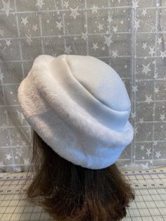 "I made this beautiful Snow White  hat out of soft white beaver faux fur and white fleece.  The brim is a 3 1/2 inch frame of white beaver faux fur and the hat is lined with a double layer of white fleece for warmth and comfort.  Sized to fit most adults 22\"-23\" around head. The hat is a comfortable fit on my 22 1/2\" head.  Spot clean or dry clean. Handmade in Albany, Oregon by me!" White Felt Hat With Flat Brim For Winter, White Faux Fur Winter Hat, White Flat Brim Felt Hat For Winter, Classic White Fur Felt Hat, White Hat With Faux Fur Lining For Winter, White Winter Hat With Faux Fur Lining, White Fur Felt Hat For Winter, White Fur Felt Winter Hat, White Brimmed Felt Hat For Winter