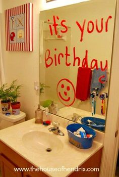 a bathroom with a birthday message on the mirror