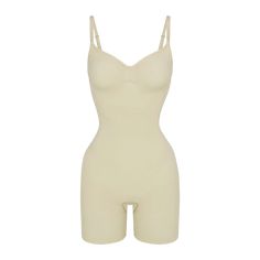 Experience the transformative power of the Sculpting Mid-Thigh Bodysuit Ivory, meticulously designed to provide a sleek and contoured silhouette with mid-thigh coverage. Crafted from high-stretch shapewear fabric, this bodysuit customizes itself for a comfortable and personalized fit, ensuring a smoother appearance.Unleash the slimming benefits of its compression technology, which works tirelessly to enhance your natural curves and provide a more defined look. Embrace confidence and elegance with every wear of the Sculpting Mid-Thigh Bodysuit. Natural Curves, Shapewear, Sleek, Benefits, Confidence, Technology, Fabric, How To Wear